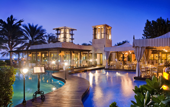 The One and Only Royal Mirage, Dubai, dining and entertainment at night time, by the pool.
